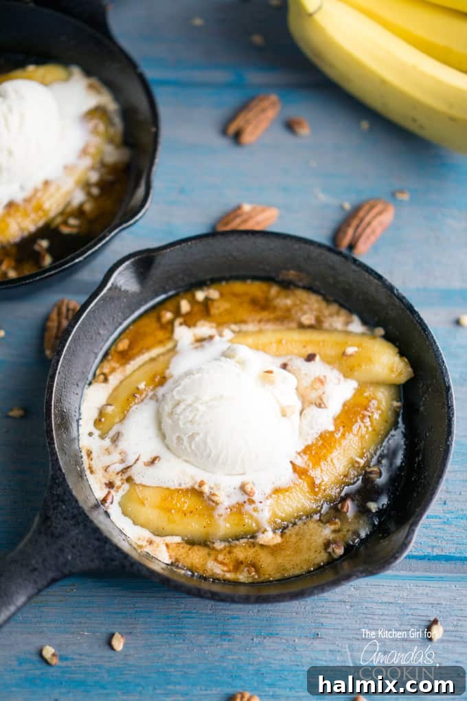 Single serve banana foster topped with vanilla ice cream in a 5-inch skillet, showcasing the rich caramel sauce.