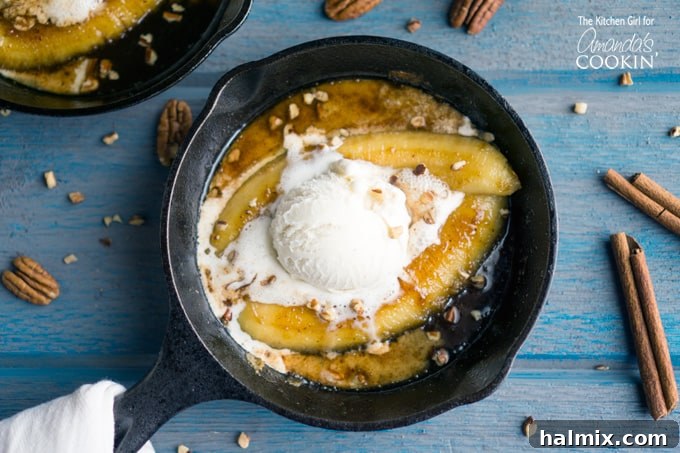Single serve banana foster topped with vanilla ice cream in a 5-inch skillet from another angle.