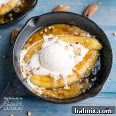 Single serve banana foster topped with vanilla ice cream in a 5" skillet.