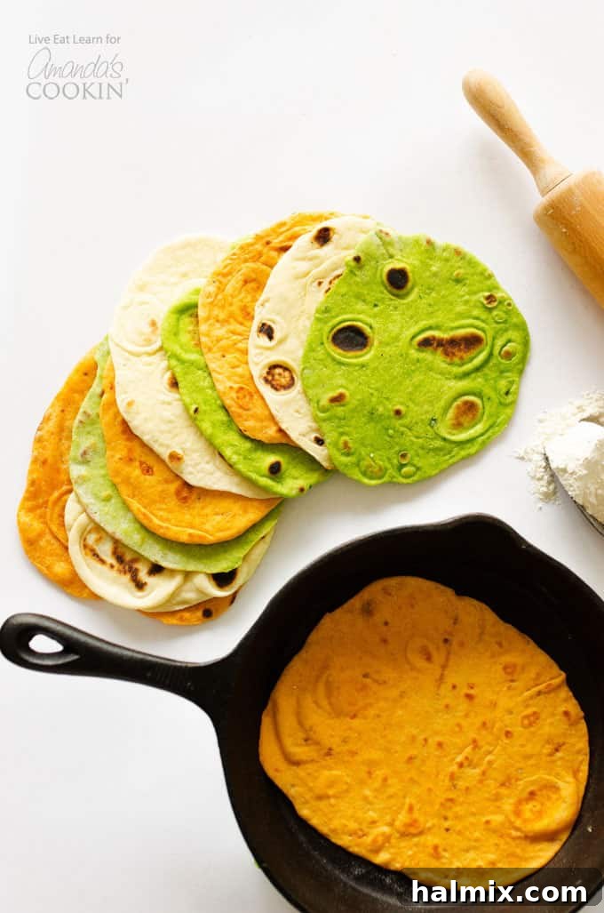 Create Your Own Deliciously Flavored Tortillas 2 An overhead picture of a homemade tortilla resting in a skillet and multiple kinds of homemade tortillas resting on a white cutting board.