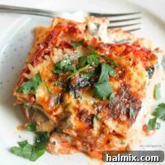Hearty Garden Lasagna 8 overhead photo of veggie lasagna on a white plate