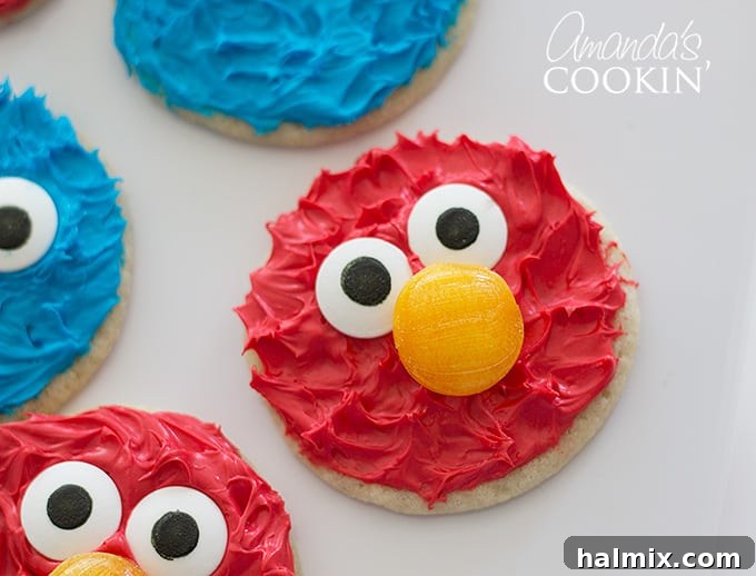 Cookie Monster and Elmo's Cookie Fun 10 Close-up of an Elmo cookie with other cookies slightly out of frame, showing fine detail