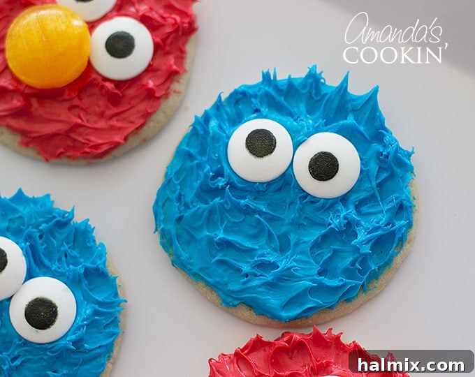 Super cute Cookie Monster and Elmo cookies are perfect for any Sesame Street themed birthday party or just a fun treat! A vibrant duo of Cookie Monster and Elmo cookies, side-by-side, showcasing their detailed decorations