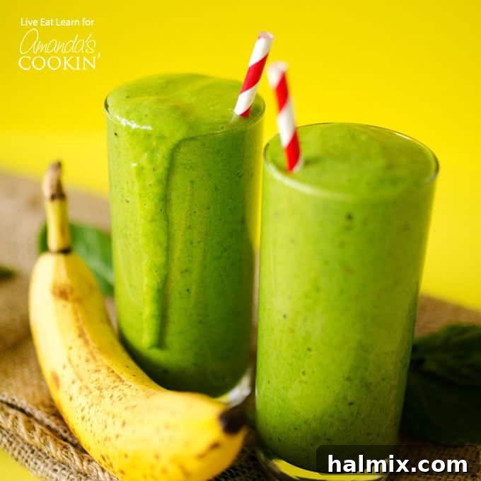 Green smoothies are a simple, delicious way to kick off your day! Perfect for a healthy on-the-go breakfast packed with veggies and fruit. Two green smoothies with bananas and red paper straws, ready to be enjoyed.