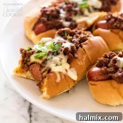 chili dogs on a white plate