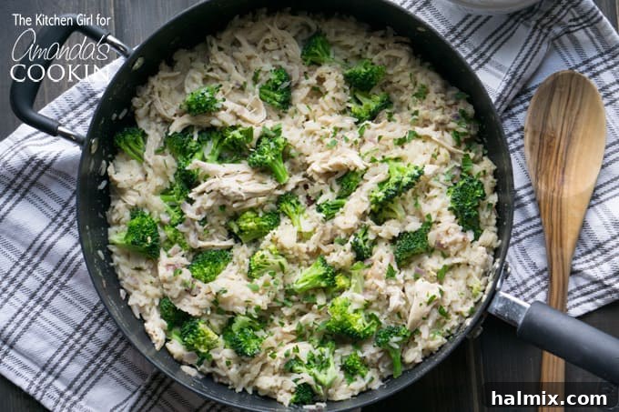 Close-up of the cooking process for Skillet Chicken Broccoli and Rice, showing onions and garlic sautéing with rice.