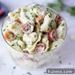 Vibrant Pesto Tortellini Salad 5 tortellini pasta salad in a glass dish