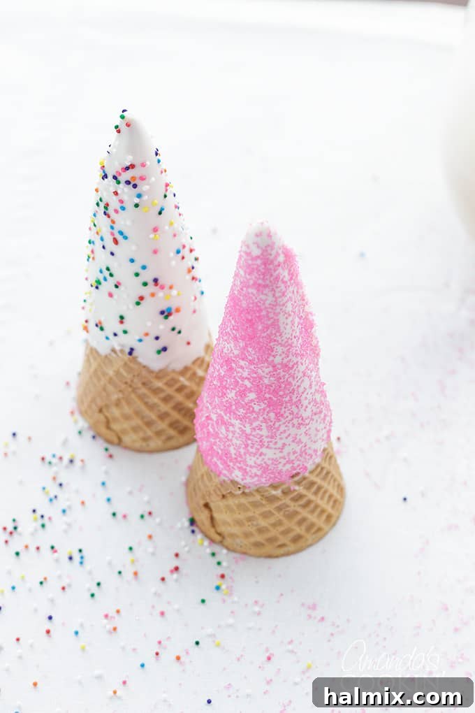 Step 4 in making unicorn freakshakes: Beautifully decorated sugar cones, now transformed into unicorn horns, ready to crown the freakshakes, highlighting the finished topping.