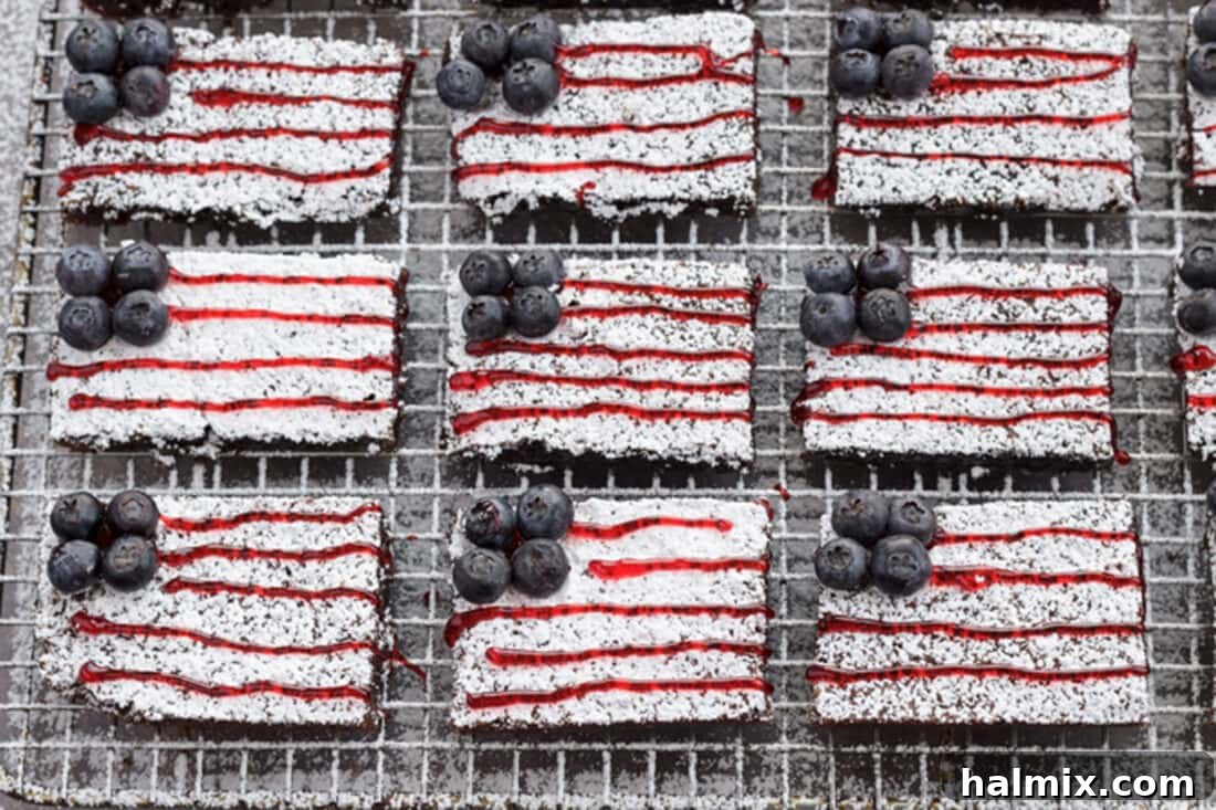 Nine American Flag Brownies neatly arranged on a wire rack, showcasing their patriotic design