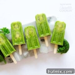Green smoothie popsicles on a plate of ice, ready to be enjoyed