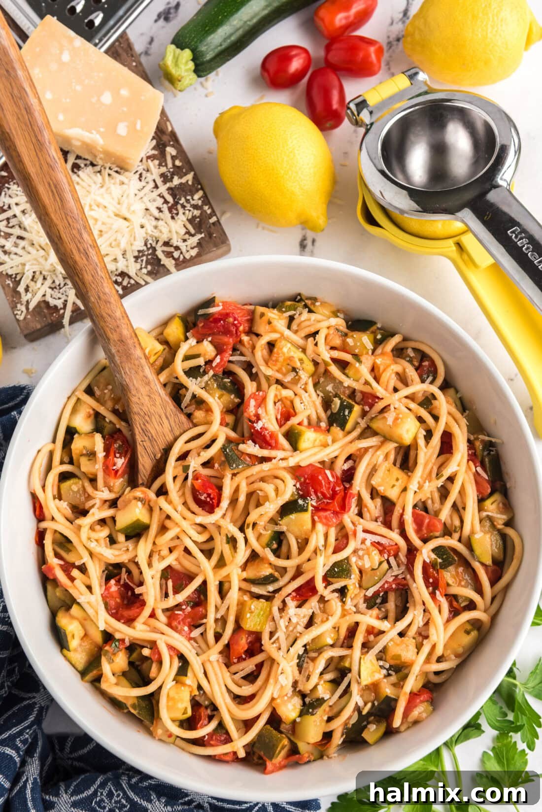 Bowl of Simple Zucchini Tomato Pasta with a spoon in it
