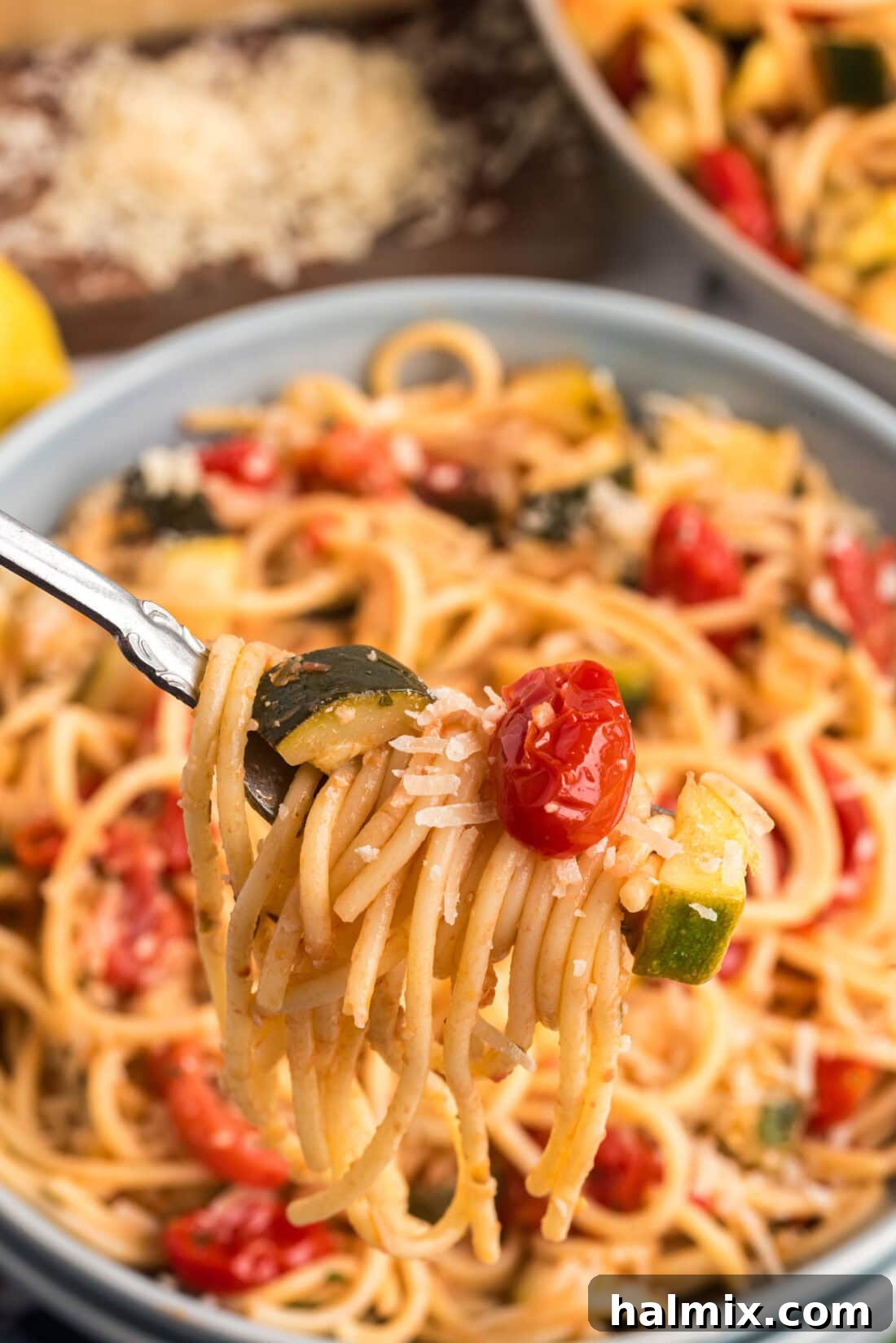 Simple Zucchini Tomato Pasta twisted on a fork