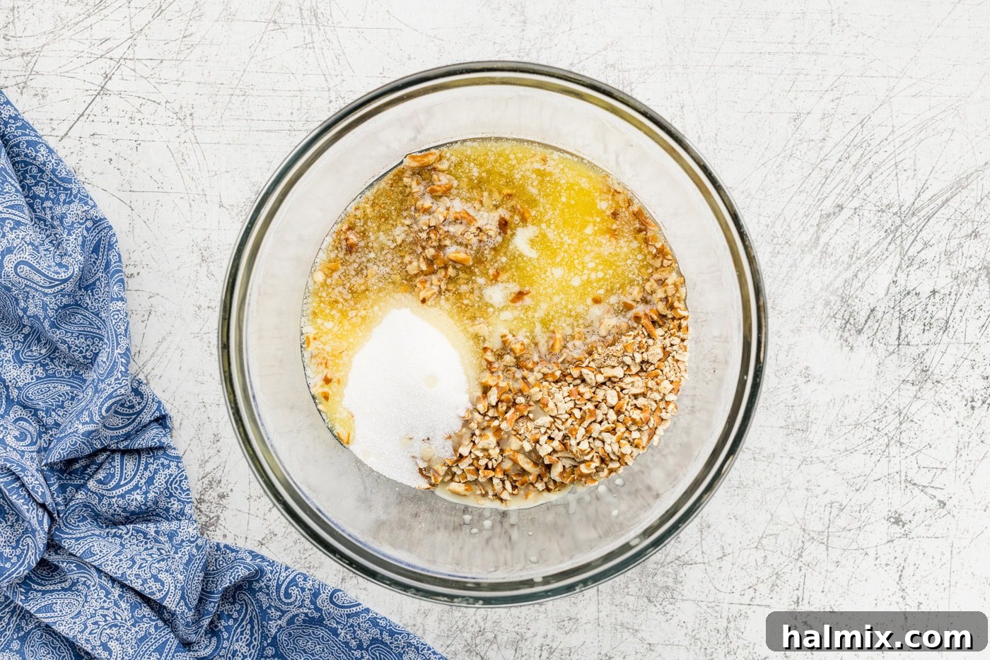 Sweet & Salty Orange Pretzel Bliss 5 pretzels, sugar, and butter in bowl