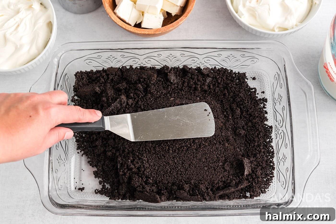 spatula patting down oreo crumbs