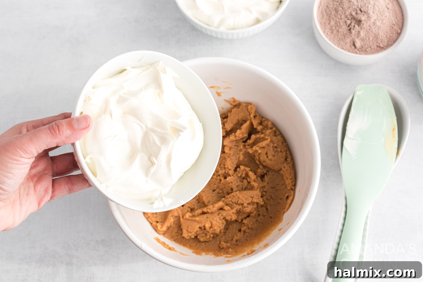 adding cool whip to peanut butter mixture