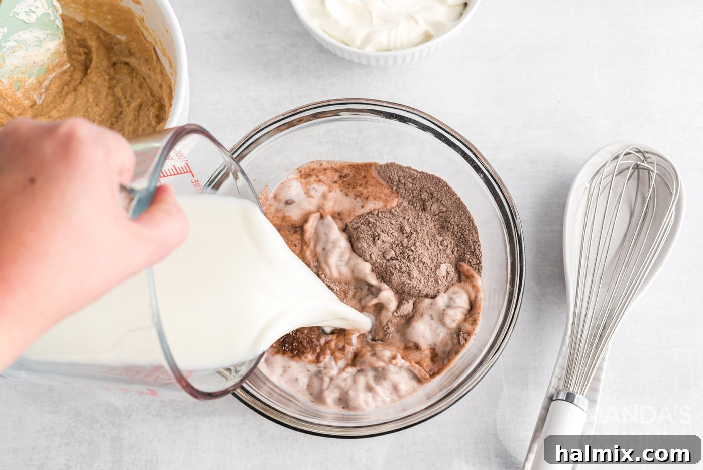 pouring milk into instant pudding