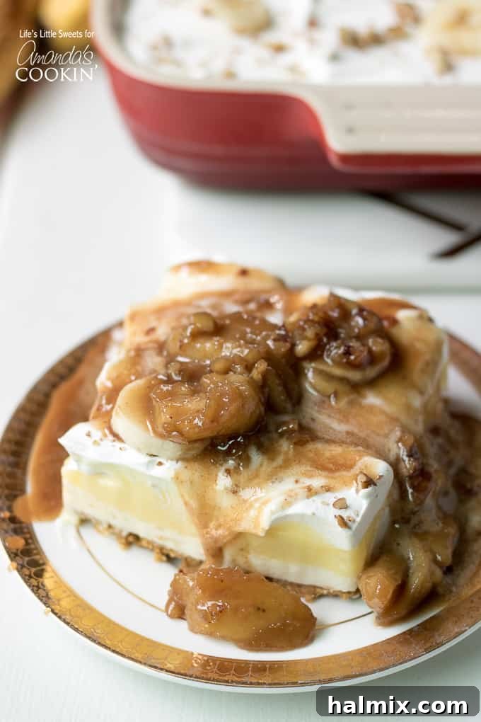 Layered banana dessert with a generous pour of warm Bananas Foster caramel sauce, topped with pecans.