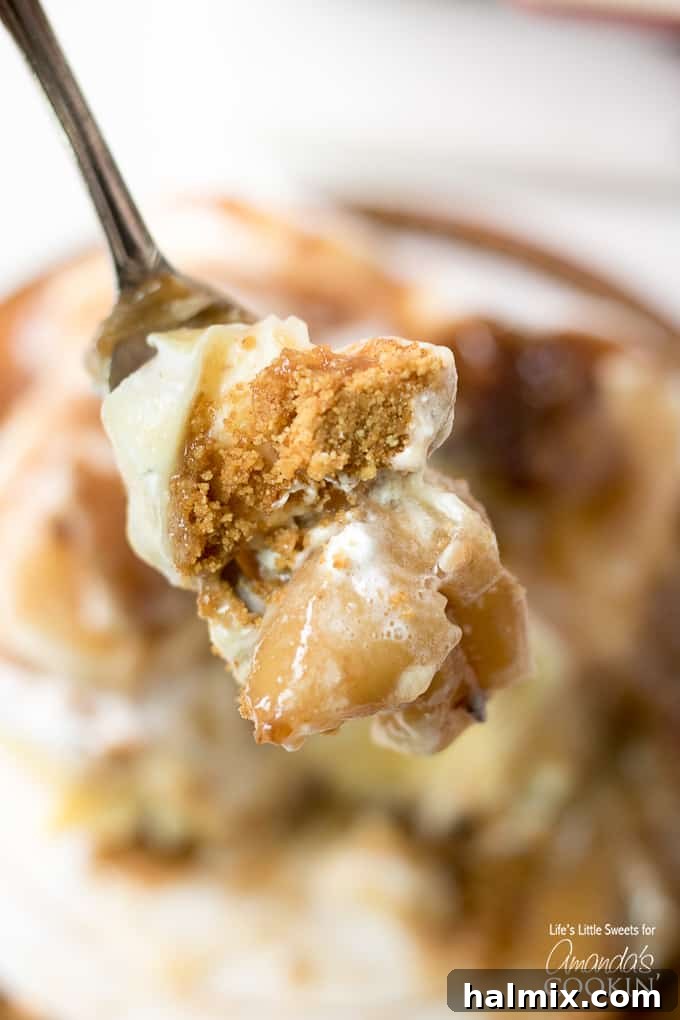 A close-up of a spoonful of Banana cream lush, showcasing the fluffy whipped topping and distinct layers.