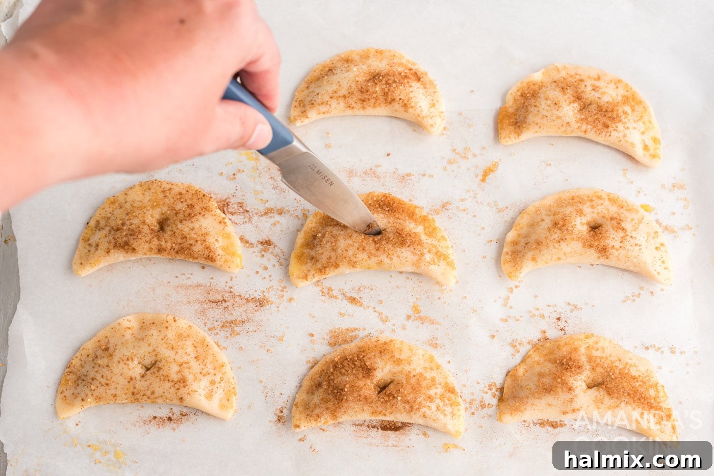 cutting a hole on top of pumpkin hand pies
