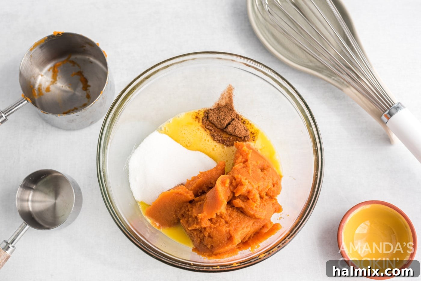 pumpkin, sugar, egg, and pumpkin spice in a bowl