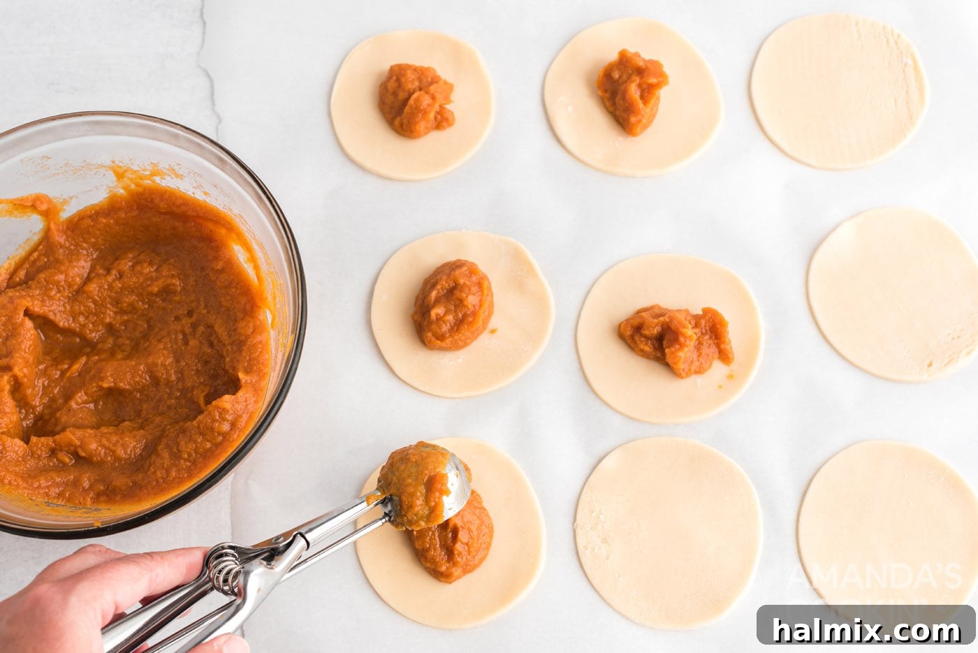 pumpkin pie filling on top of dough discs