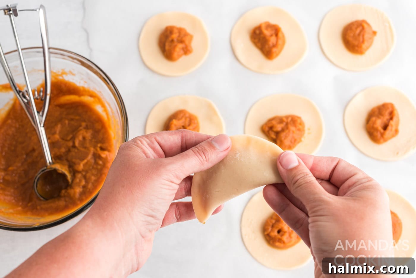 crimping and sealing the borders of pumpkin hand pies