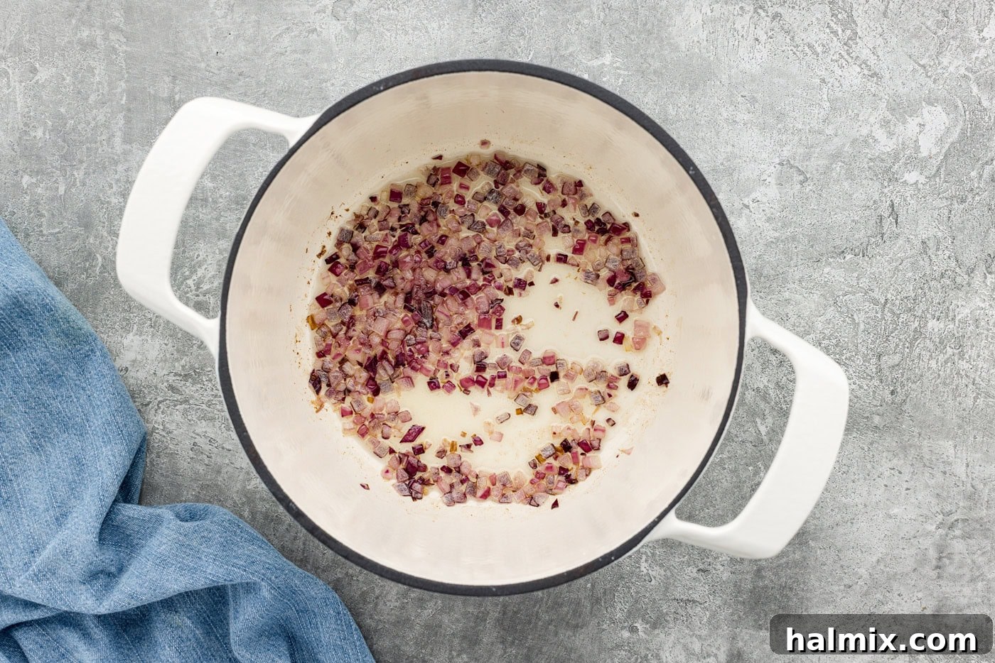 Garden Harvest Rice Soup 5 chopped red onion in a pot with olive oil being sautéed