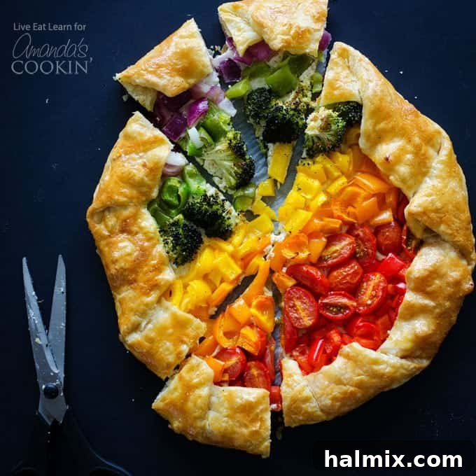 A perfect slice of Vegetable Rainbow Tart, showcasing its delicious layers and colorful appeal. A close-up shot of a slice of the Vegetable Rainbow Tart, showing the vibrant layers of vegetables and the creamy ricotta base on a flaky golden crust.