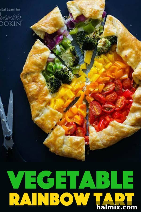 The ultimate Vegetable Rainbow Tart: A visually stunning and incredibly delicious savory pastry, perfect for any meal or gathering. A large, perfectly baked Vegetable Rainbow Tart with distinct rows of colorful vegetables, presented on a wooden board, showcasing its visual appeal and golden crust.