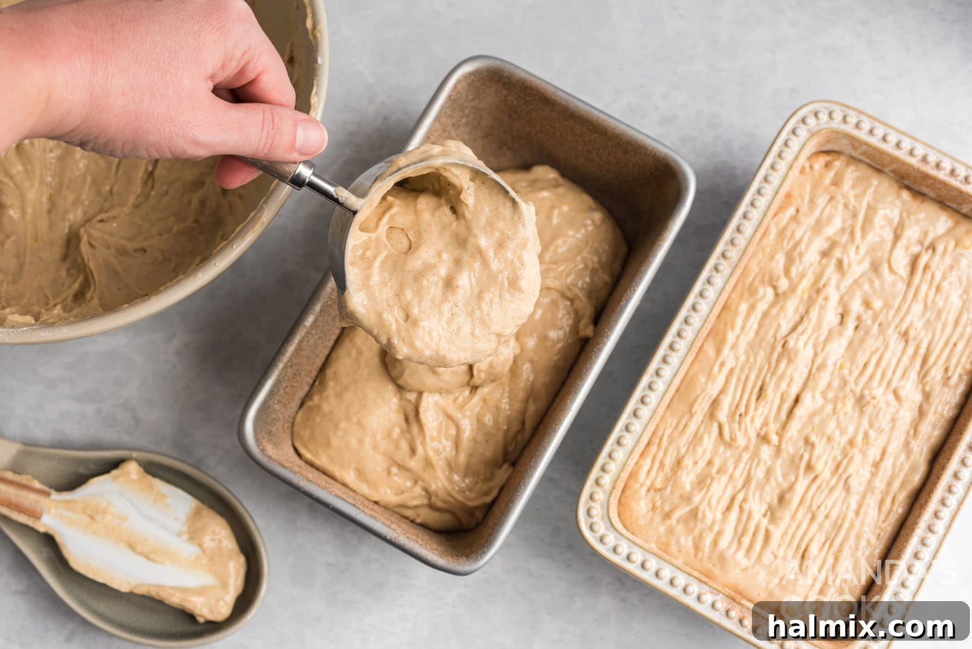 adding banana bread batter to loaf pan