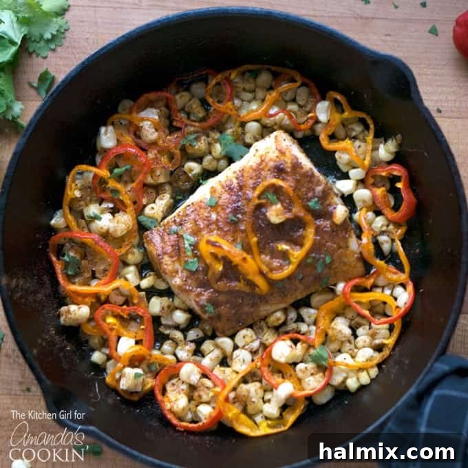 cast iron pan with cod and vegetables