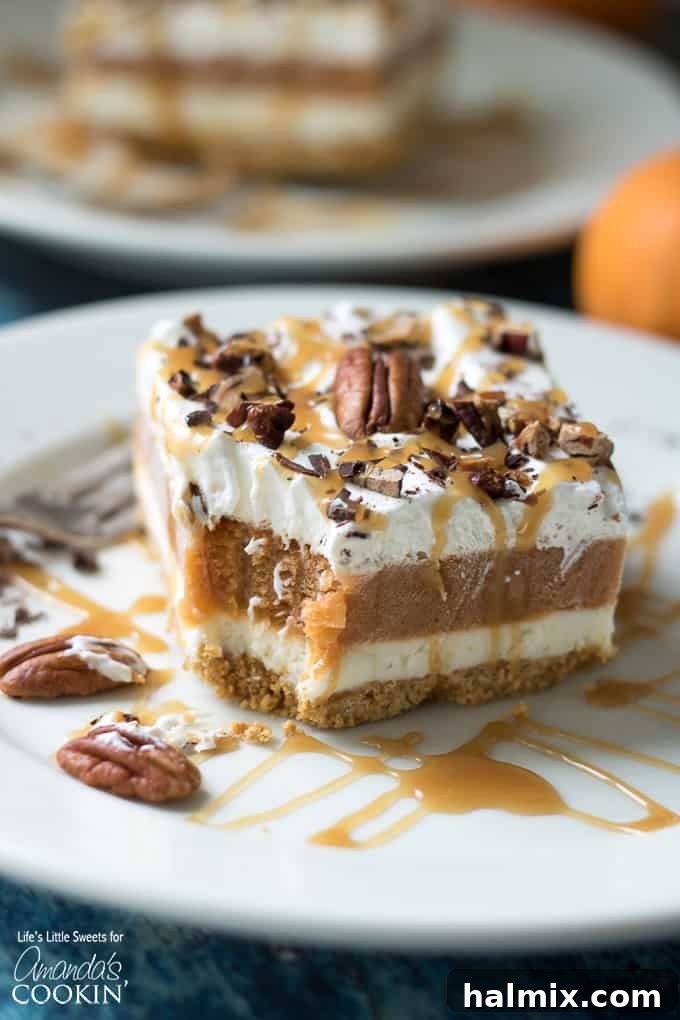 slice of pumpkin dessert with a bite out of it on plate