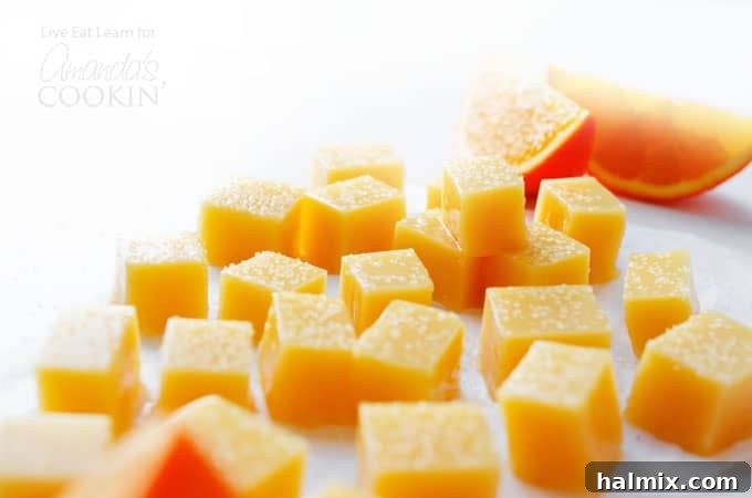 Easy Orange Creamsicle Gummies: A guilt-free pleasure. #gummycandy #healthytreats #homemadefood #orangecreamsicle A colorful array of homemade gummies, showcasing their bright orange hue and inviting texture.