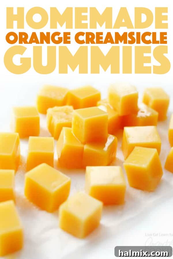 You can make your own Orange Creamsicle Homemade Gummies with just a few ingredients (and no fancy thermometers or steps required!) #gummies #creamsicle #homemade #orange #snacks #candy #homemadecandy A delicious display of easy homemade Orange Creamsicle Gummies in a bowl, inviting a taste.