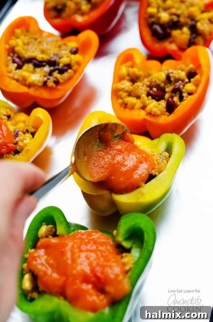 Adding sauce to enchilada stuffed peppers