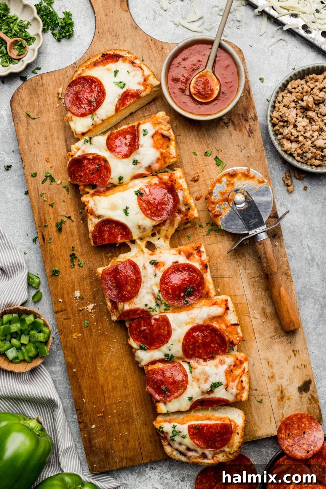 Pepperoni French Bread Pizza sliced on a wooden board