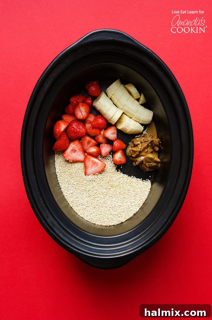 Slow Cooker Breakfast Quinoa: Effortless Overnight Meal Prep Ingredients for slow cooker breakfast quinoa in the crockpot, including quinoa, milk, strawberries, and bananas