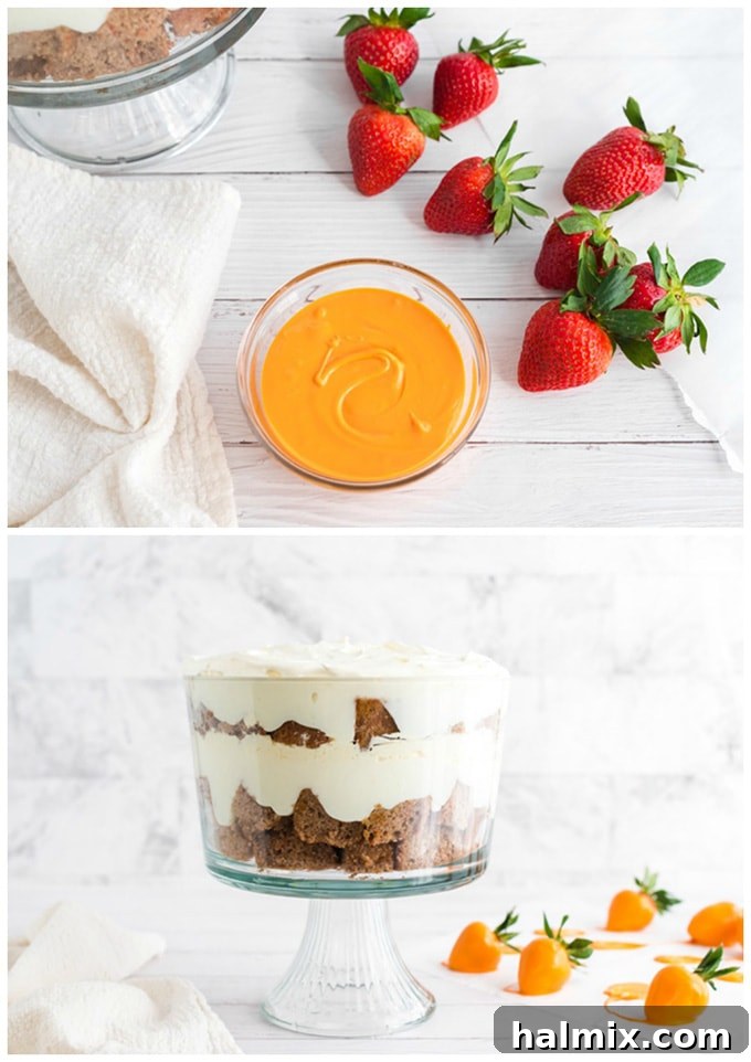 Strawberries being dipped into melted orange candy melts to create the carrot decorations for the trifle.
