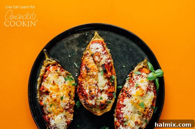 The process of hollowing out an eggplant and mixing the filling