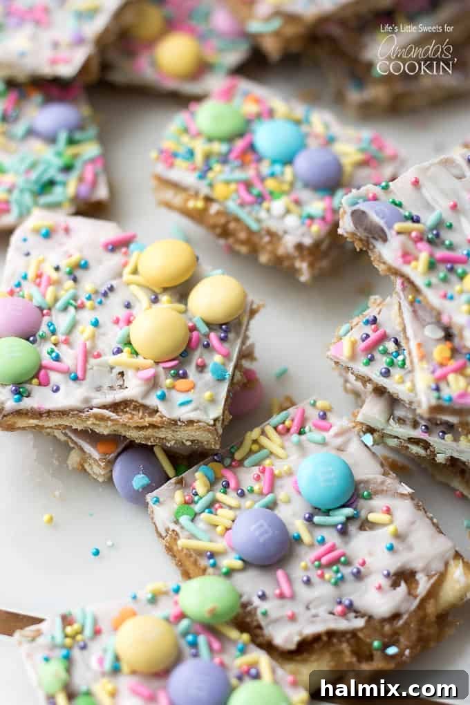 This Easter crack is a festive Saltine Toffee. An easy-to-make recipe using simple pantry ingredients like white chocolate, sprinkles, and Easter candies. #easterdessert #easter #eastercandy #saltinetoffee #saltinecrack #whitechocolate #holidaydessert Festive Easter Crack candy