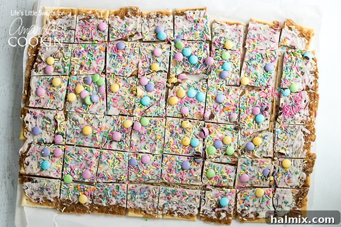 This Easter crack is a festive Saltine Toffee. An easy-to-make recipe using simple pantry ingredients like white chocolate, sprinkles, and Easter candies. #easterdessert #easter #eastercandy #saltinetoffee #saltinecrack #whitechocolate #holidaydessert Easter Crack Recipe: festive saltine toffee