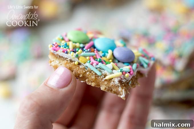 This Easter crack is a festive Saltine Toffee. An easy-to-make recipe using simple pantry ingredients like white chocolate, sprinkles, and Easter candies. #easterdessert #easter #eastercandy #saltinetoffee #saltinecrack #whitechocolate #holidaydessert Piece of easter crack