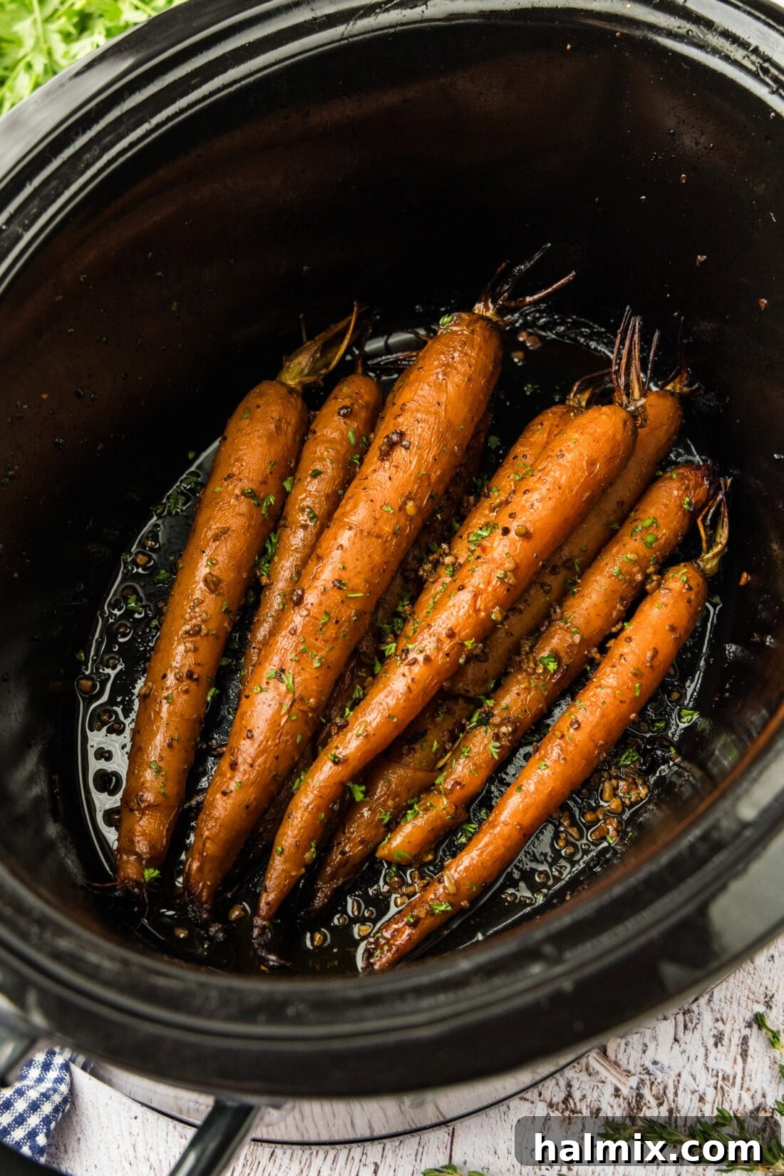 Melt-in-Your-Mouth Balsamic Glazed Carrots 2 Delicious slow cooker balsamic carrots simmering in a crockpot