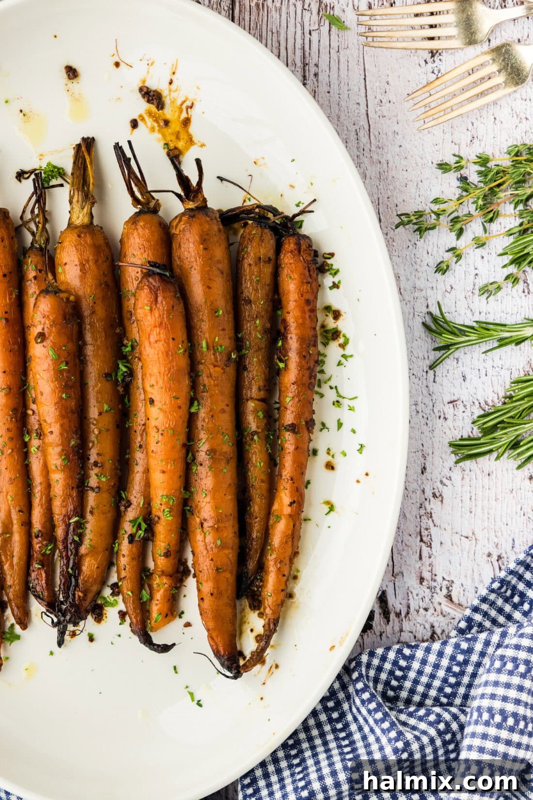 Melt-in-Your-Mouth Balsamic Glazed Carrots 3 Perfectly glazed slow cooker balsamic carrots served on an elegant white platter
