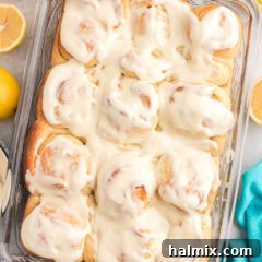 Close up photo of a pan of Lemon Sweet Rolls with luscious icing.