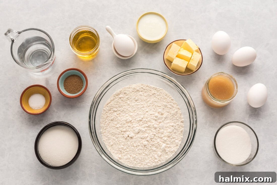 Arrangement of ingredients laid out for making lemon sweet rolls, including fresh lemons, butter, sugar, and flour.