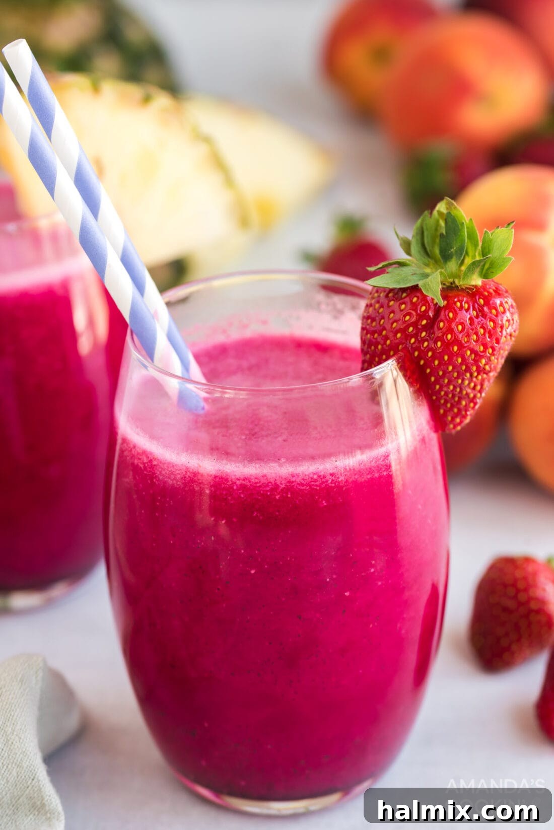 Close-up of a refreshing wine slushie in a glass with a straw, showing its smooth, icy texture.