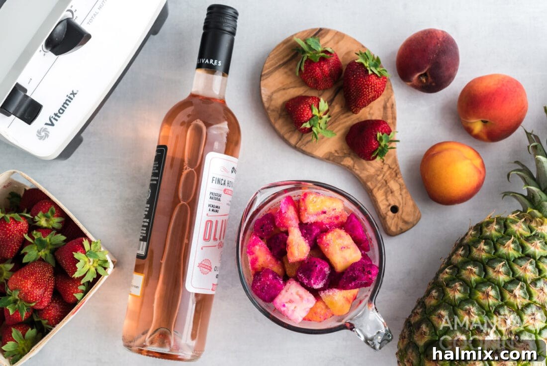 Two key ingredients for wine slushies: a bottle of rosé wine and a bag of mixed frozen fruit.