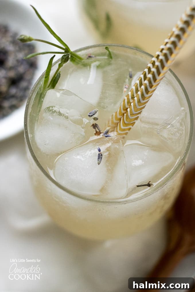 Overhead view of a glass of Lavender Lemonade with fresh lavender leaves