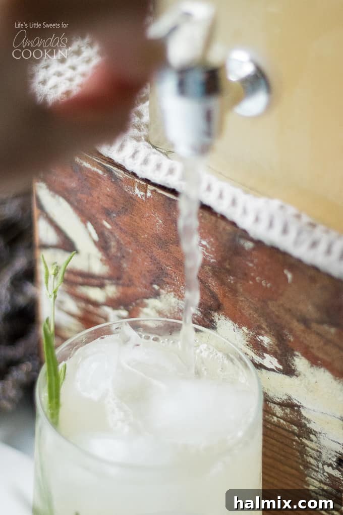 Pouring homemade Lavender Lemonade into a glass